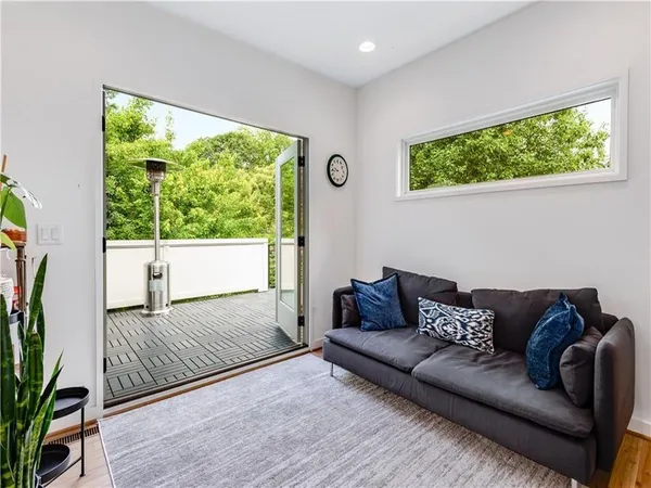 a living room with furniture and a large window