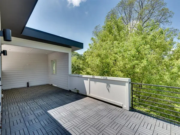 a view of a patio with wooden floor