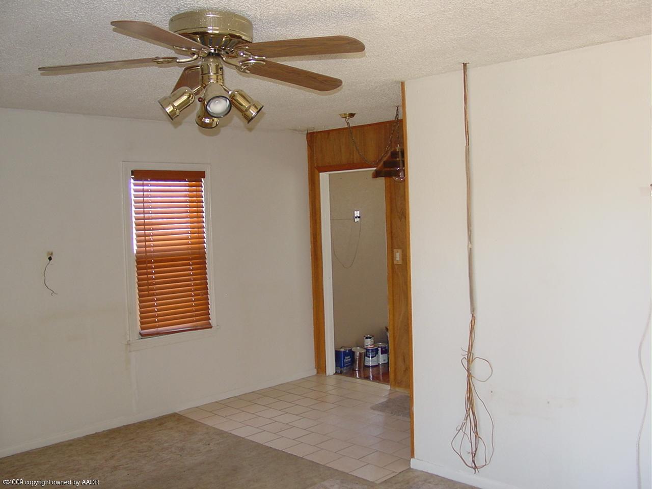 3603 South Lipscomb Street Amarillo, TX 79110 - Photo 3 of 4 a view of a room with a windows and ceiling fan