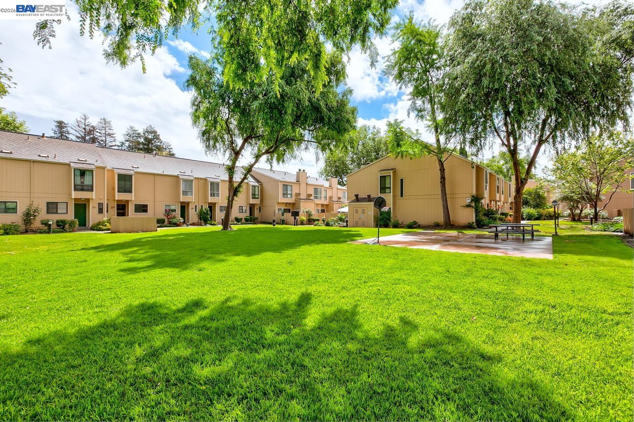 9005 Alcosta Boulevard, Unit 199 San Ramon, CA 94583 - Photo 55 of 57 a view of a house with a big yard and large trees
