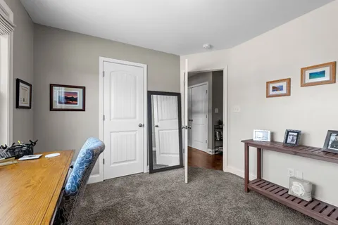 a view of a livingroom with furniture and closet