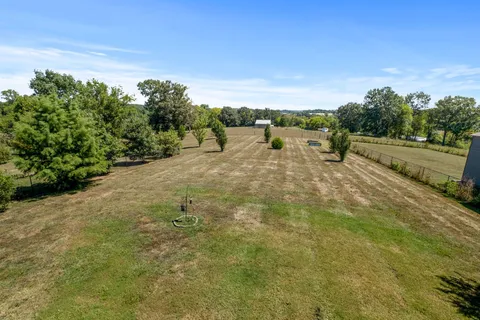 a view of a road with an trees in the background