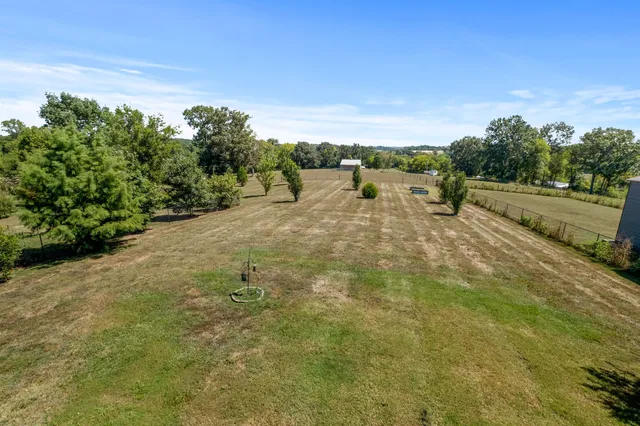 a view of a road with an trees in the background