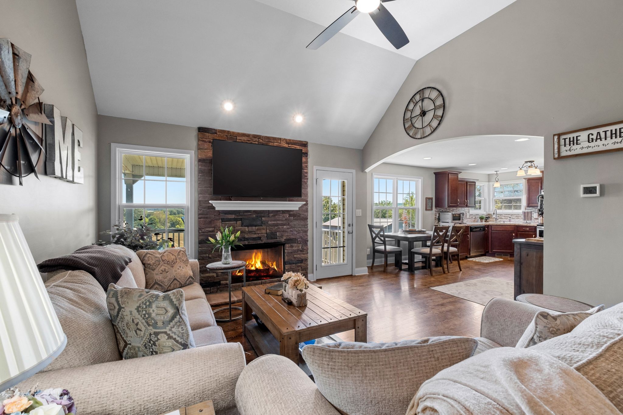 133 Sandi's Lane Palmyra, TN 37142 - Photo 7 of 38 a living room with furniture and a fireplace