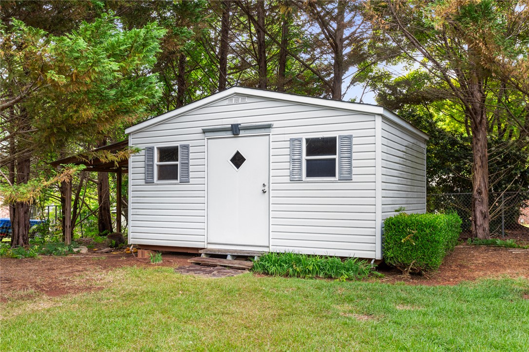 202 Keowee Trail Seneca, SC 29672 - Photo 28 of 35 This outdoor shed provides ample storage solutions within a lush, private yard.