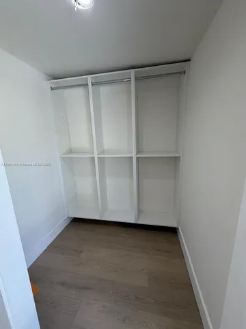 a view of an empty walk in closet