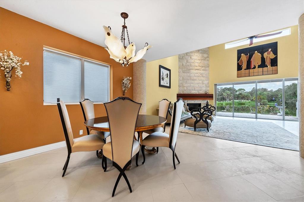 7716 Club Lane Sarasota, FL 34238 - Photo 20 of 68 a view of a dining room with furniture a chandelier and window