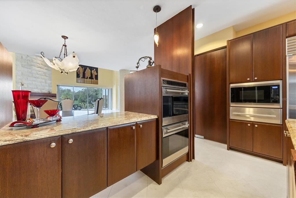 7716 Club Lane Sarasota, FL 34238 - Photo 27 of 68 a kitchen with stainless steel appliances granite countertop a refrigerator and a sink
