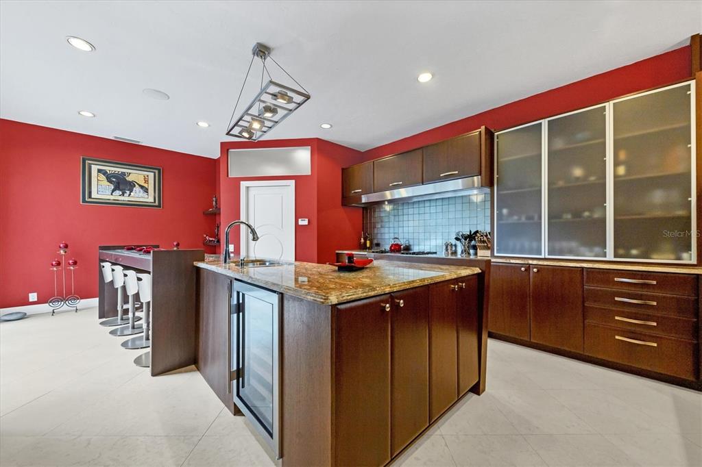 7716 Club Lane Sarasota, FL 34238 - Photo 29 of 68 a kitchen that has a sink and a stove in it