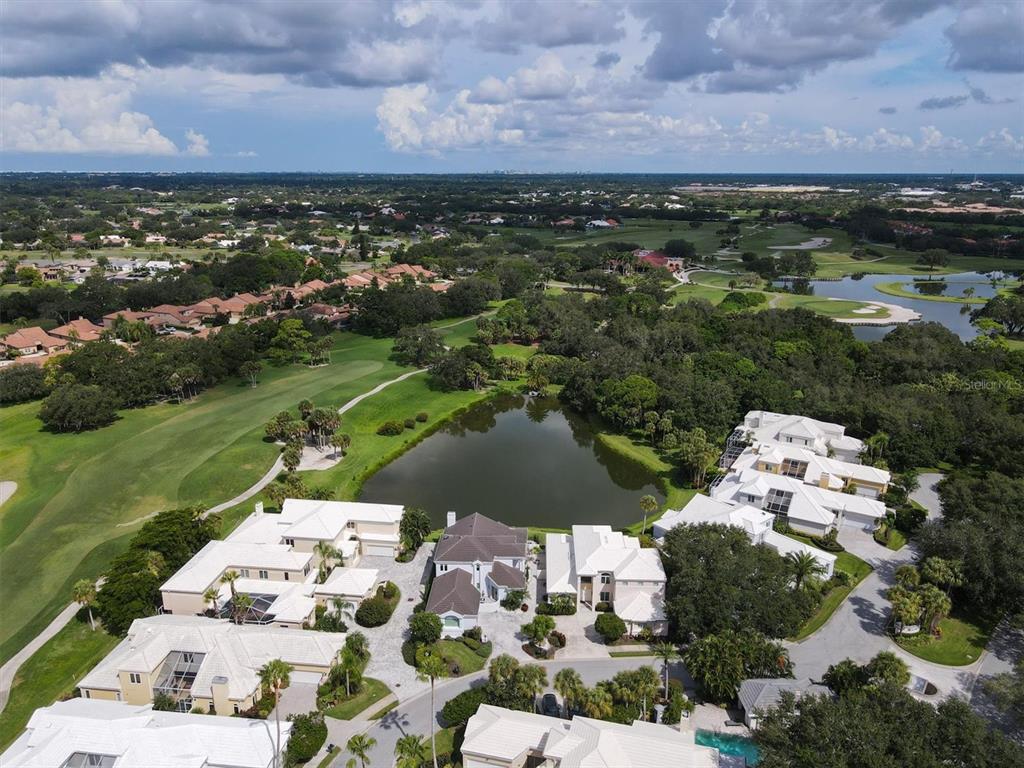7716 Club Lane Sarasota, FL 34238 - Photo 3 of 68 an aerial view of a house with a lake view