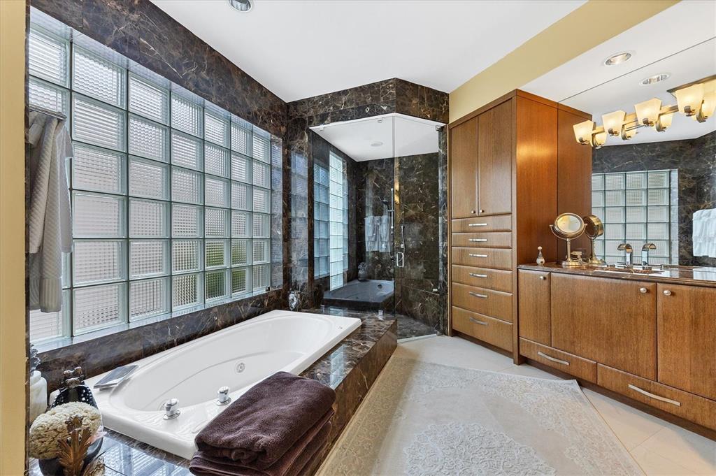 7716 Club Lane Sarasota, FL 34238 - Photo 37 of 68 a bathroom with a tub and sink