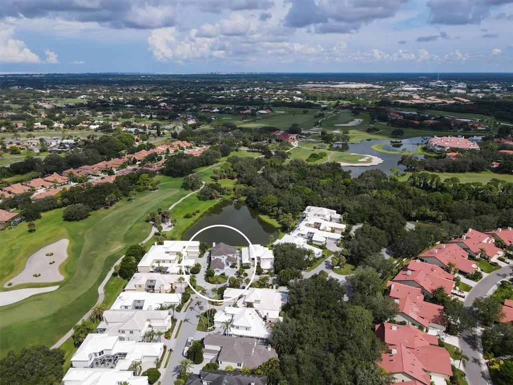 7716 Club Lane Sarasota, FL 34238 - Photo 4 of 68 an aerial view of a house with a yard lake view