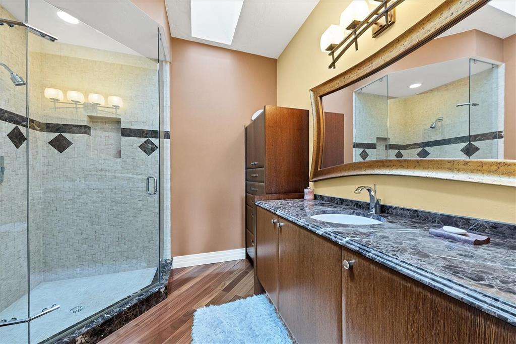 7716 Club Lane Sarasota, FL 34238 - Photo 49 of 68 a bathroom with a granite countertop sink and a mirror
