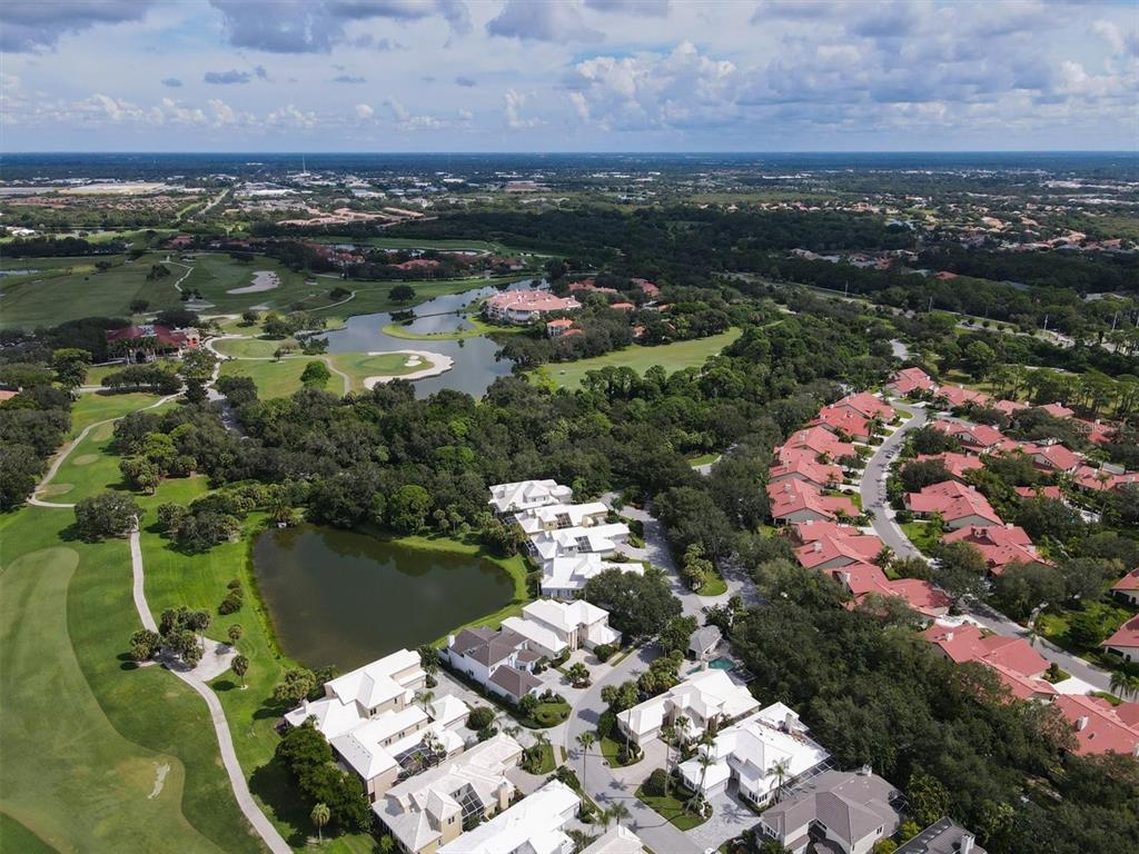 7716 Club Lane Sarasota, FL 34238 - Photo 54 of 68 an aerial view of lake houses and outdoor space