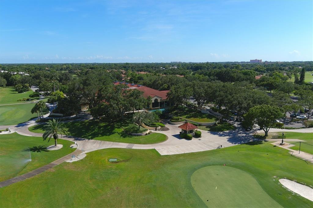 7716 Club Lane Sarasota, FL 34238 - Photo 60 of 68 an aerial view of a golf course with a lake view