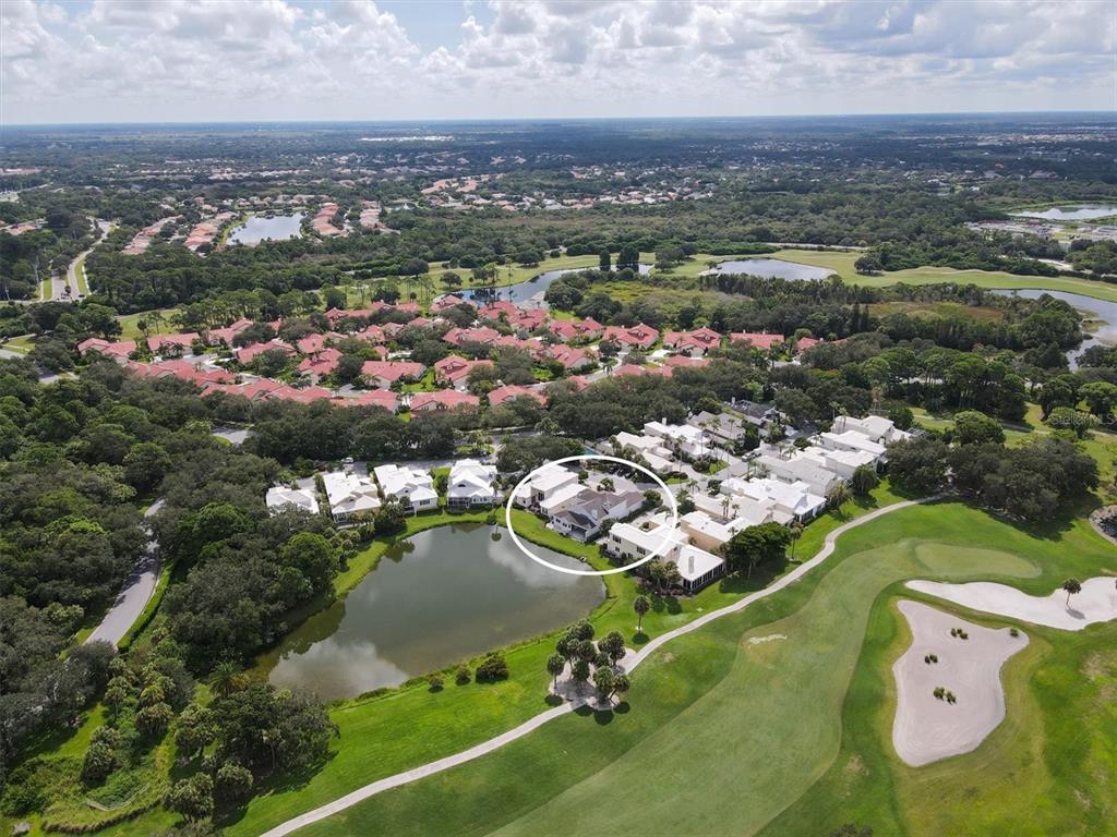7716 Club Lane Sarasota, FL 34238 - Photo 8 of 68 an aerial view of a city with lots of residential buildings lake and ocean view