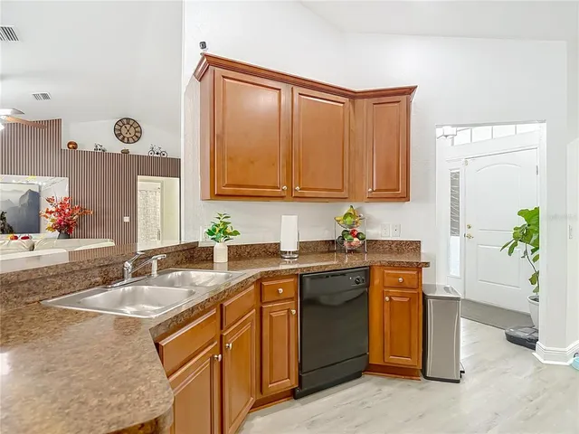 a living room with fireplace furniture and a wooden floor