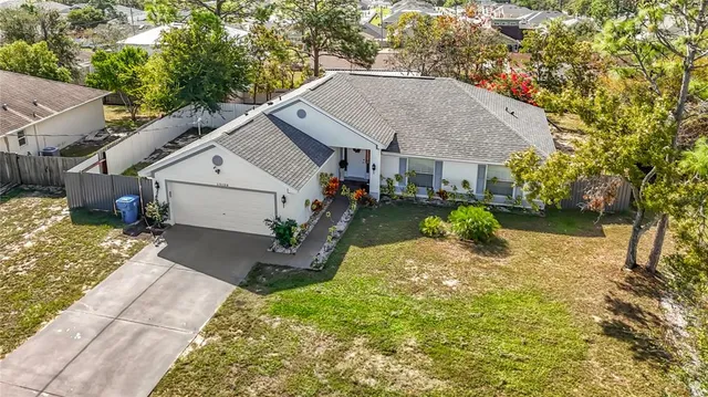 a front view of house with yard and green space