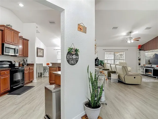 a view of a workspace with furniture and wooden floor