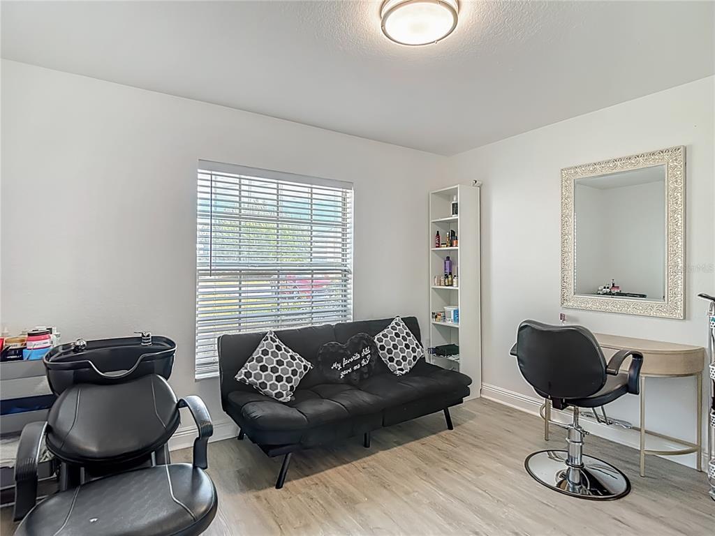 13108 Oneida Street Spring Hill, FL 34609 - Photo 23 of 62 a living room with furniture and a window