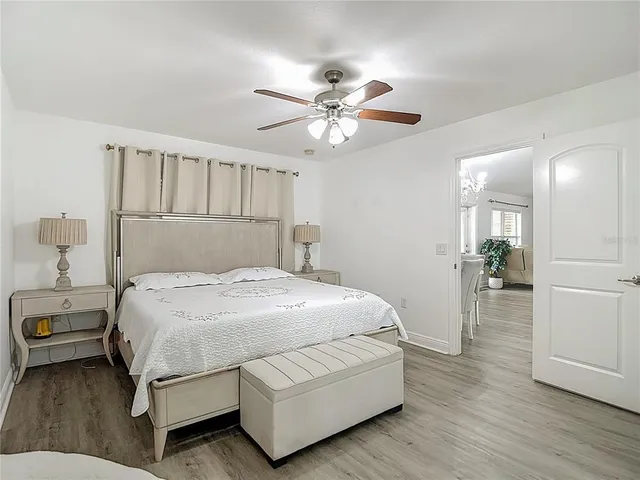 a bathroom with a tub a window and a shower