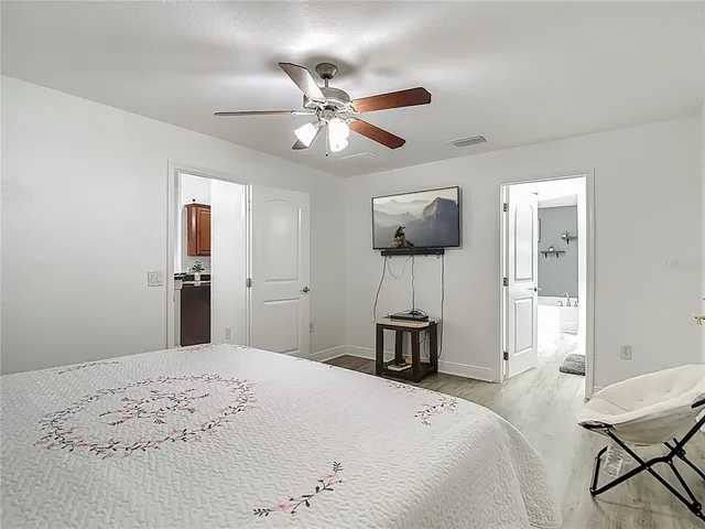 a spacious bathroom with a double vanity sink and a mirror