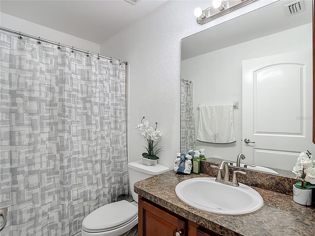 13108 Oneida Street Spring Hill, FL 34609 - Photo 43 of 62 a bathroom with a sink toilet and shower