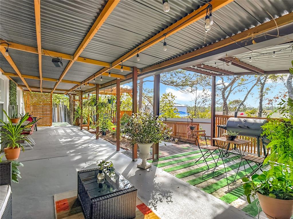 13108 Oneida Street Spring Hill, FL 34609 - Photo 53 of 62 a outdoor living space with furniture and garden