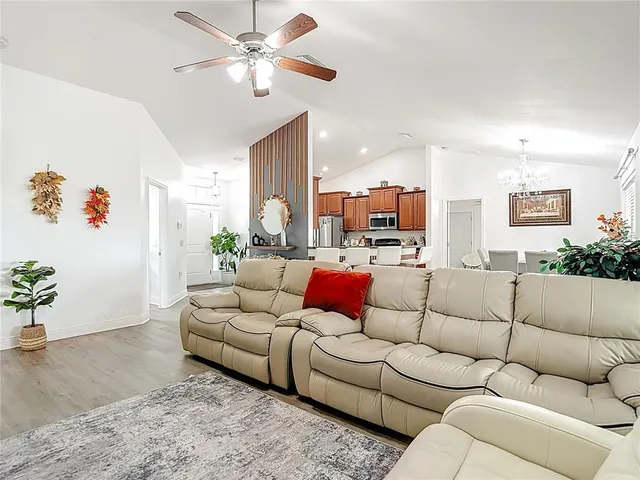 a living room with furniture and flowers