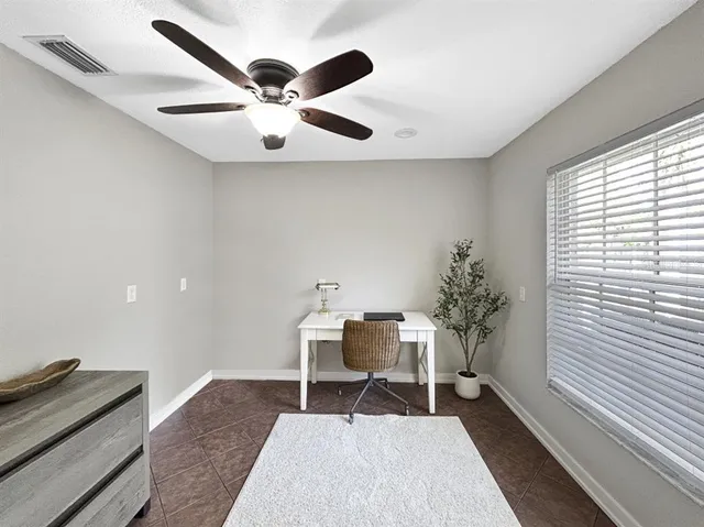 a workspace with furniture and window