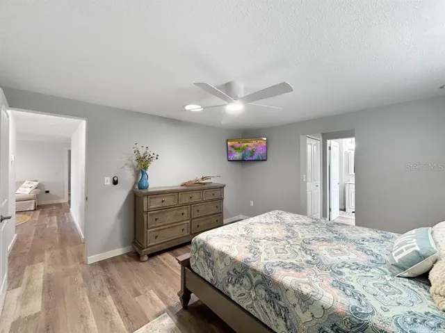 a bedroom with a bed and a dresser