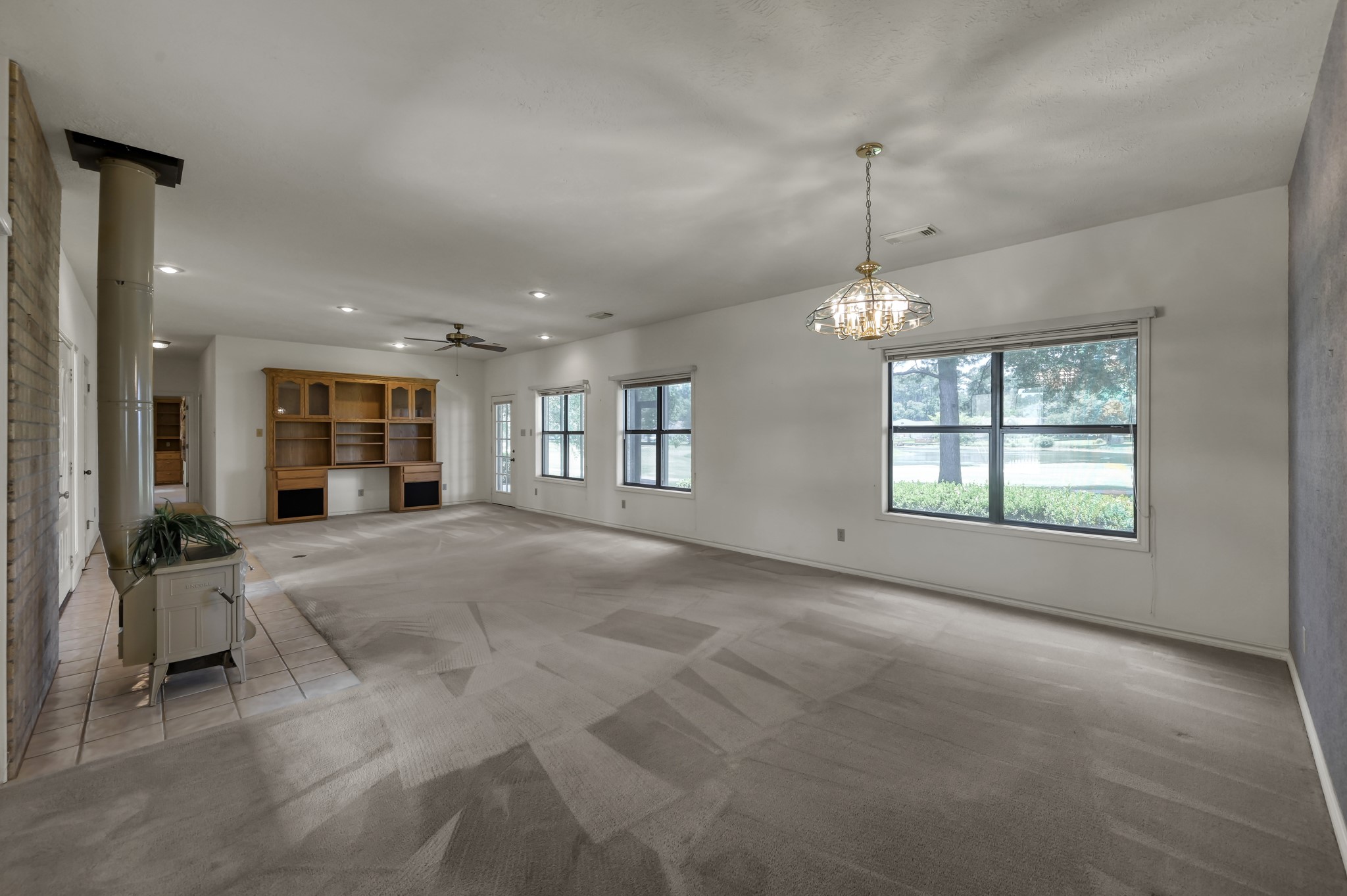 273 Augusta Drive Trinity, TX 75862 - Photo 9 of 50 Huge living/dining combo room with large windows overlooking golf course and lake.