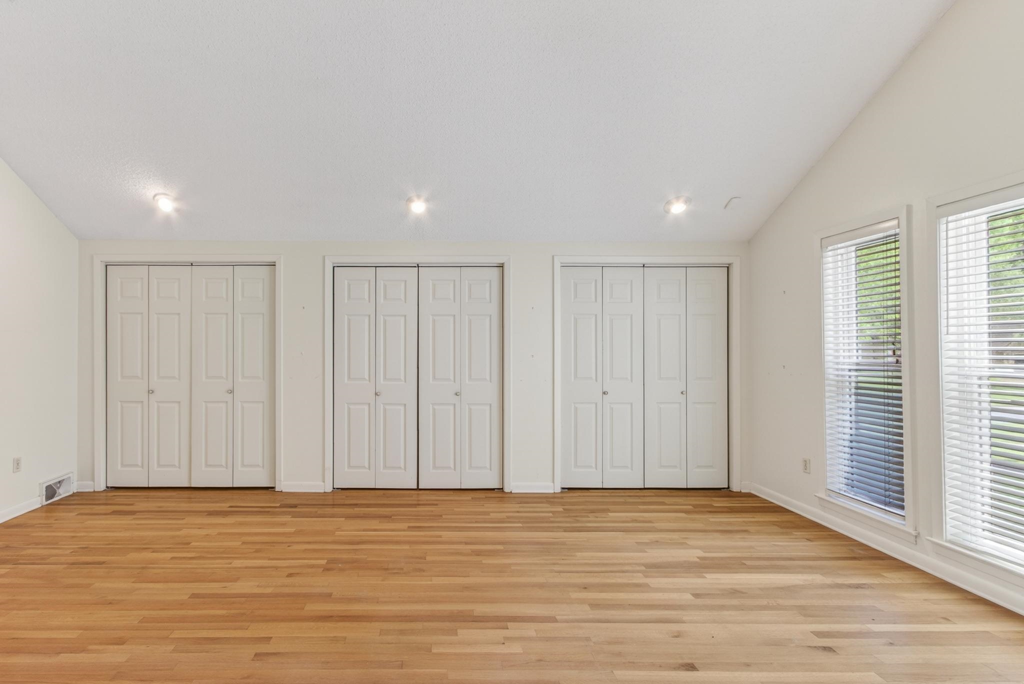 3121 Beechrun Drive Memphis, TN 38128 - Photo 21 of 40 Three generous double closets provide exceptional storage, while the unique design elements of the room create a peaceful and sophisticated retreat.