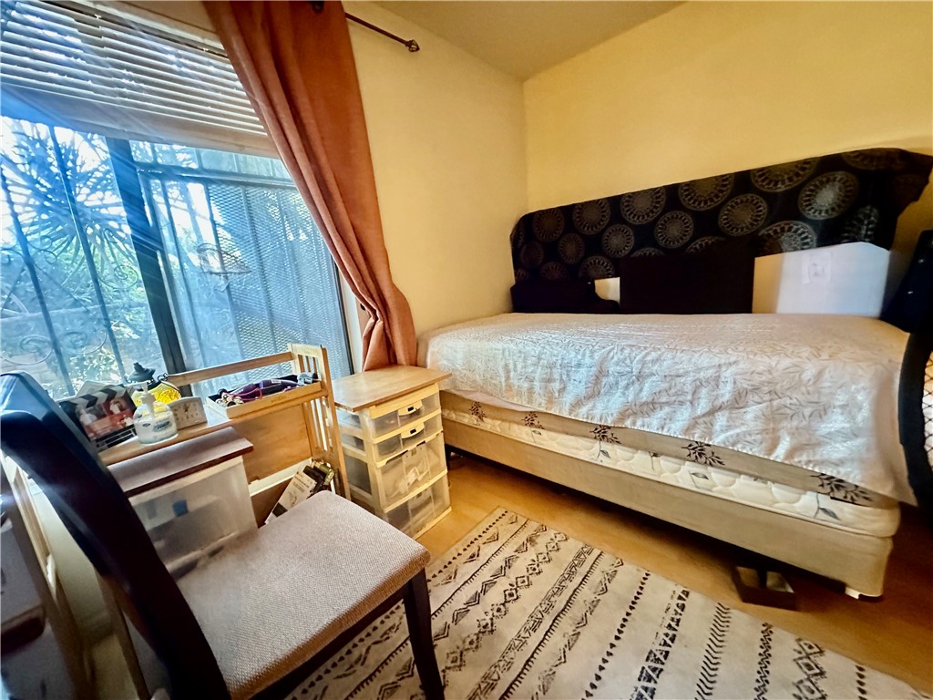 4501 Peck Road, Unit 63 El Monte, CA 91732 - Photo 17 of 21 a bedroom with a bed window and couch