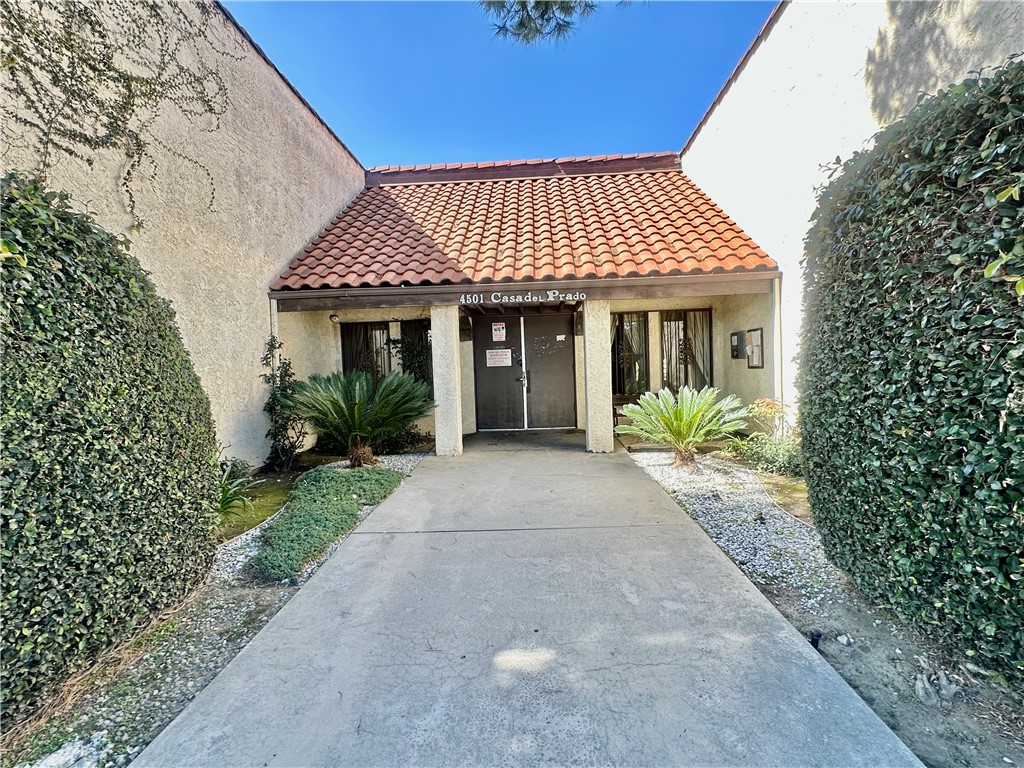 4501 Peck Road, Unit 63 El Monte, CA 91732 - Photo 2 of 21 a front view of a house with garden