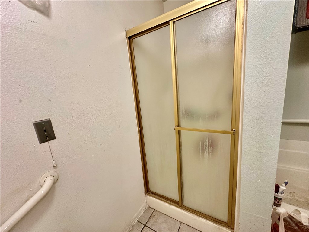 4501 Peck Road, Unit 63 El Monte, CA 91732 - Photo 10 of 21 a bathroom with a glass shower door