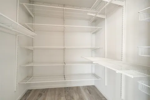 a view of an empty walk in closet
