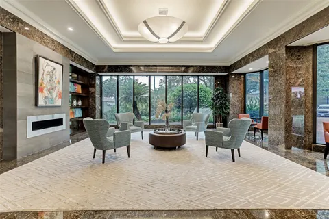 a view of swimming pool with outdoor seating and plants