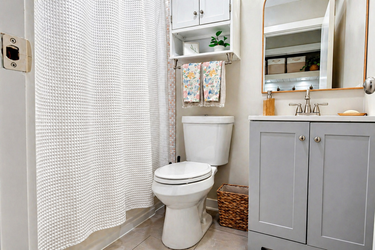 11N980 Almora Terrace Elgin, IL 60124 - Photo 11 of 29 a bathroom with a toilet sink and mirror