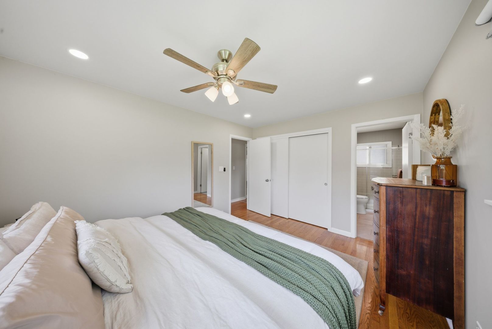 11N980 Almora Terrace Elgin, IL 60124 - Photo 13 of 29 a bedroom with a large bed and wooden floor