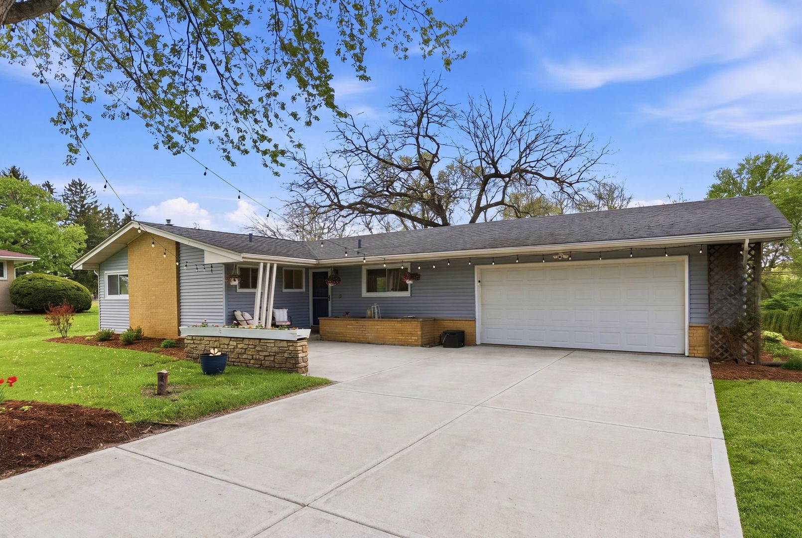 11N980 Almora Terrace Elgin, IL 60124 - Photo 2 of 29 a front view of a house with a yard and garage