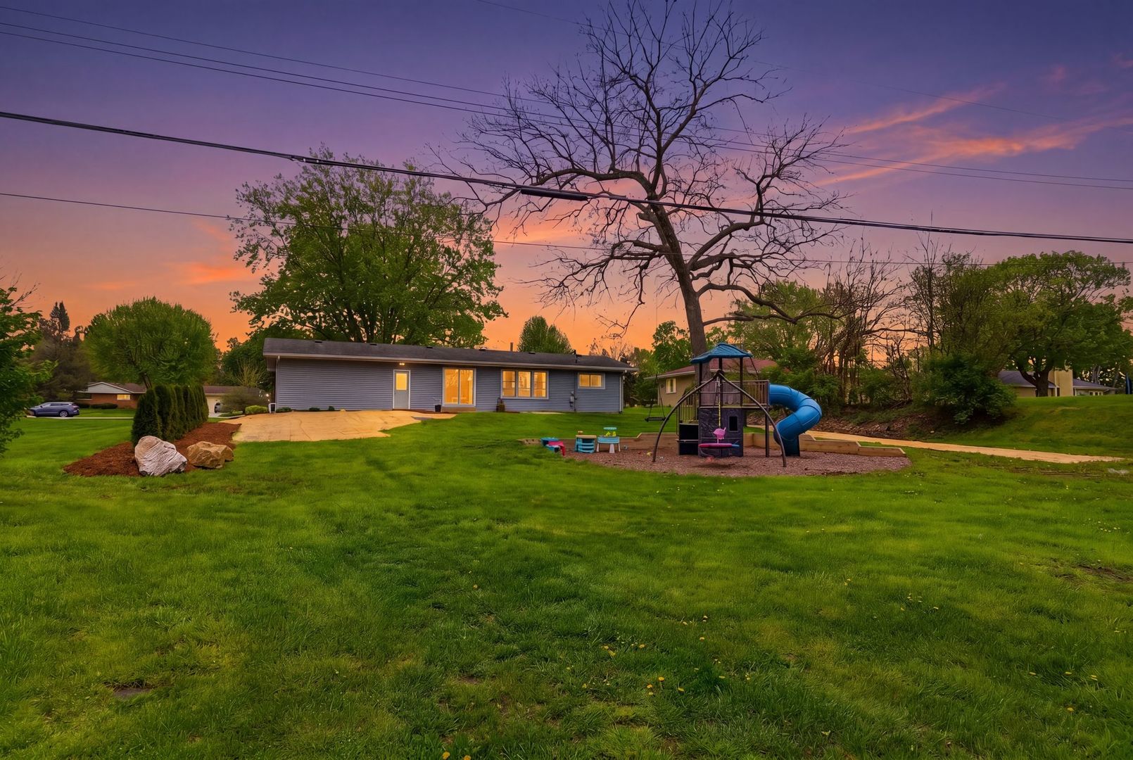 11N980 Almora Terrace Elgin, IL 60124 - Photo 26 of 29 a view of a house with a backyard porch and sitting area