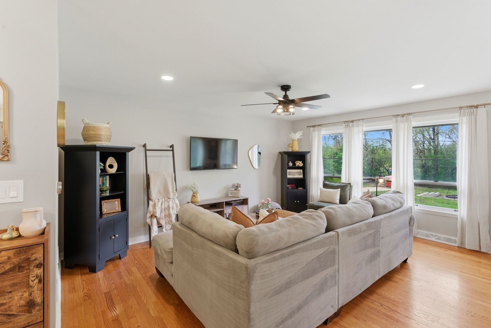 11N980 Almora Terrace Elgin, IL 60124 - Photo 6 of 29 a living room with furniture and a flat screen tv