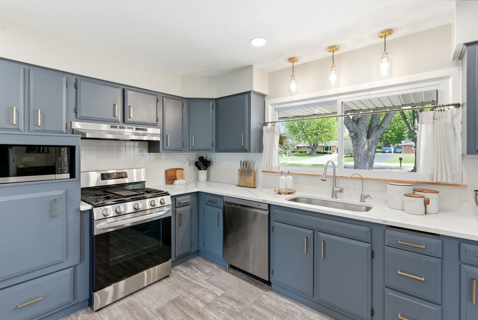11N980 Almora Terrace Elgin, IL 60124 - Photo 8 of 29 a kitchen with cabinets wooden floor and a sink