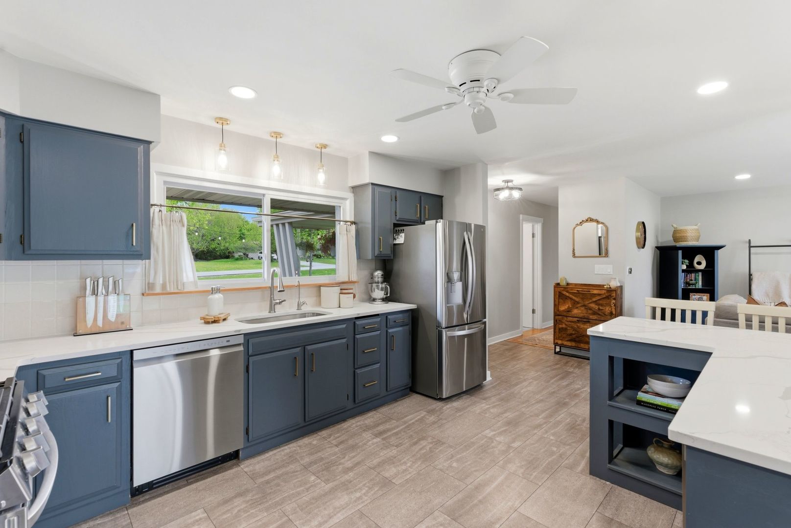 11N980 Almora Terrace Elgin, IL 60124 - Photo 9 of 29 a large kitchen with a large counter top appliances and cabinets