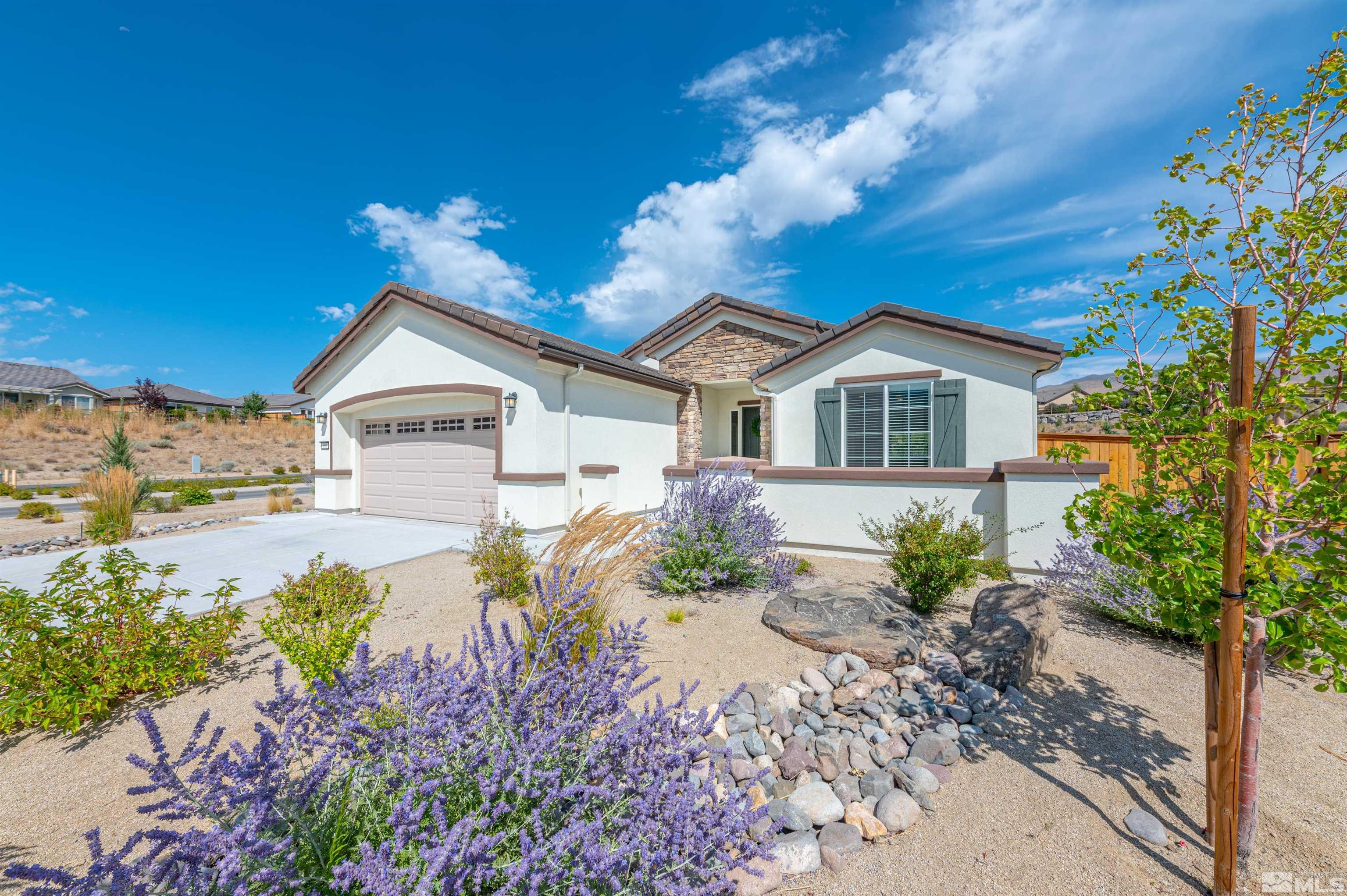 990 Broderick Trail Reno, NV 89523 - Photo 1 of 38 a front view of a house with a yard