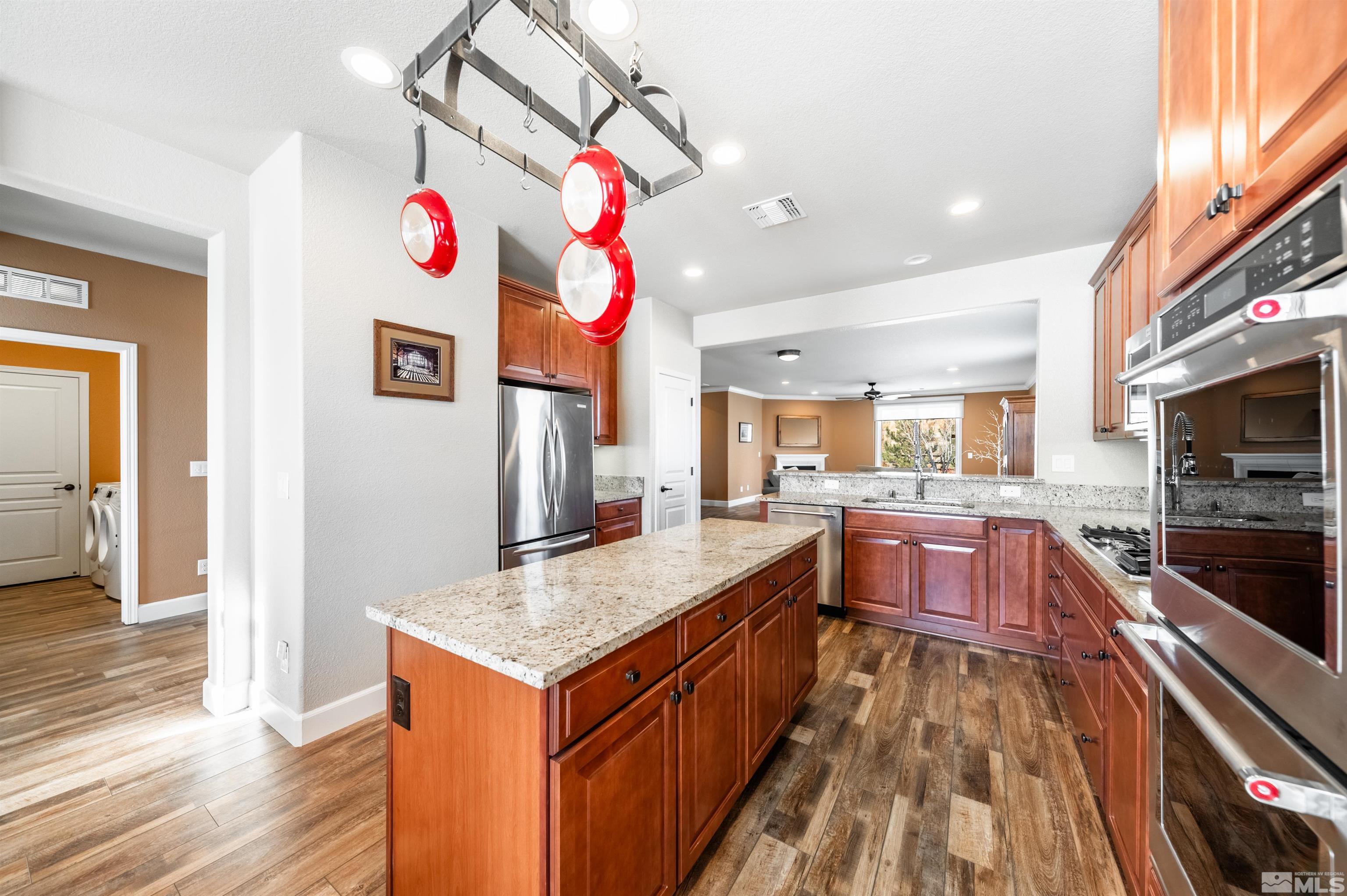 990 Broderick Trail Reno, NV 89523 - Photo 11 of 38 a kitchen with granite countertop counter top space a sink and appliances