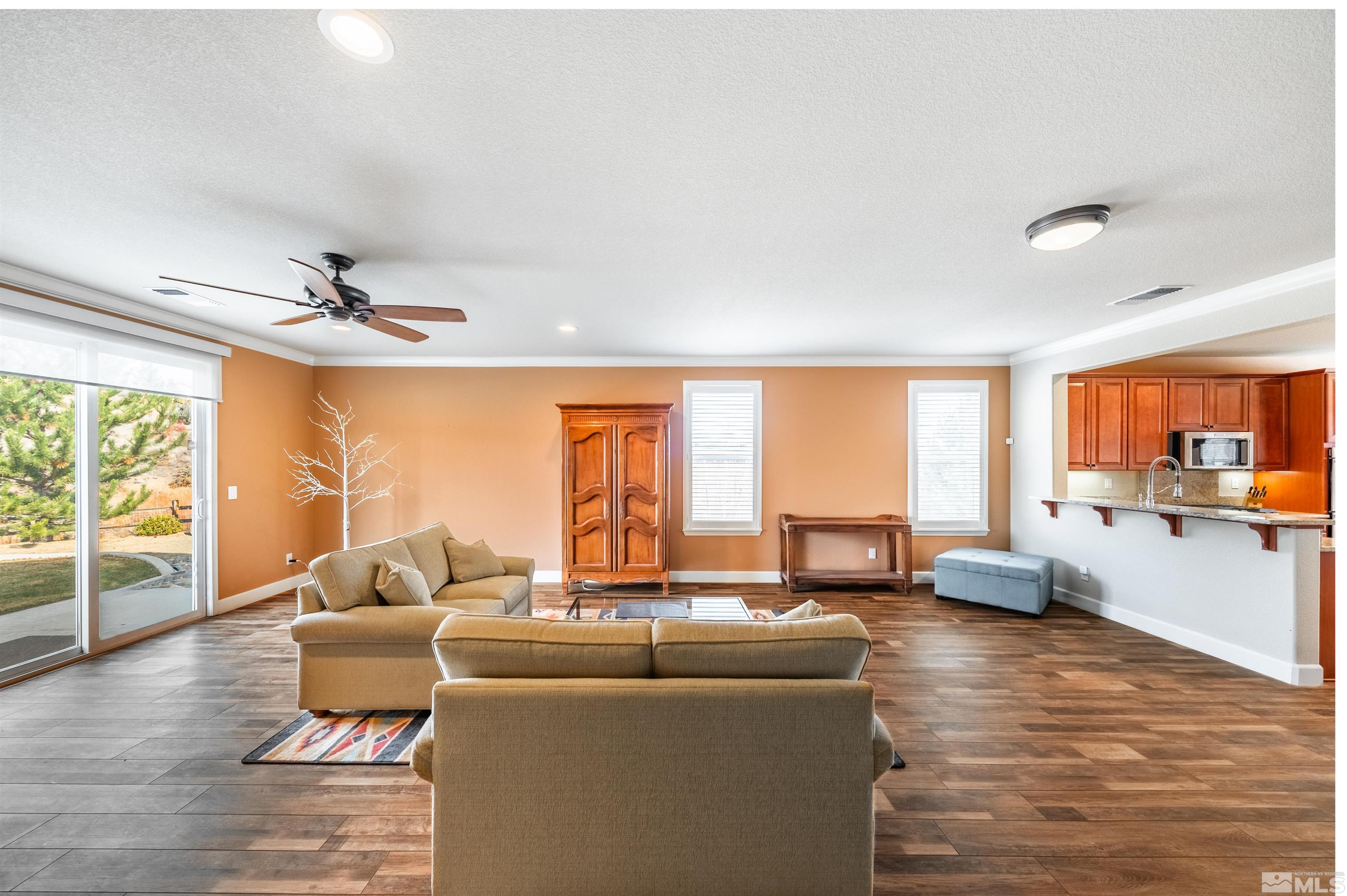 990 Broderick Trail Reno, NV 89523 - Photo 20 of 38 a living room with furniture and large windows