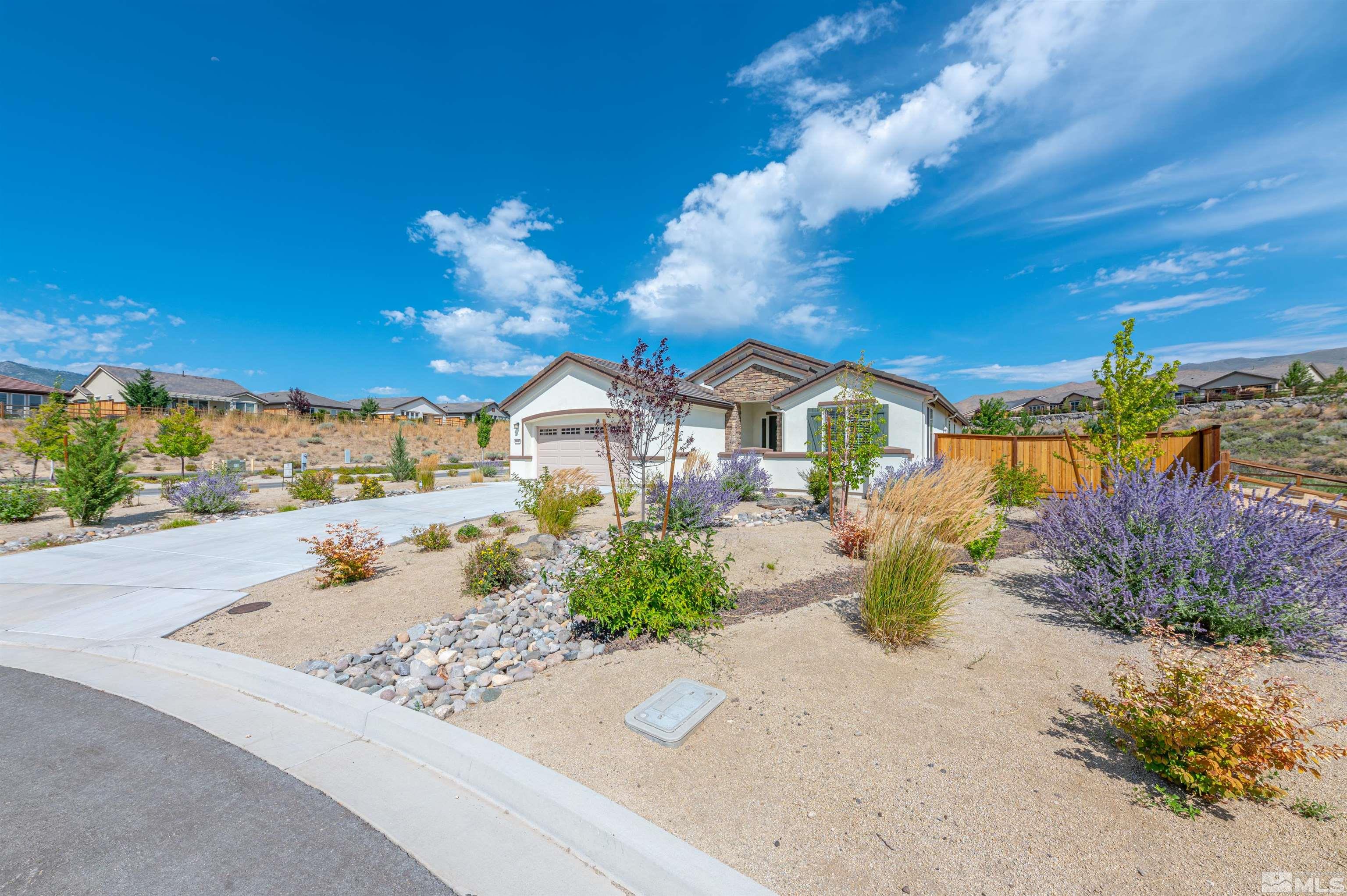 990 Broderick Trail Reno, NV 89523 - Photo 2 of 38 a front view of a house with a yard