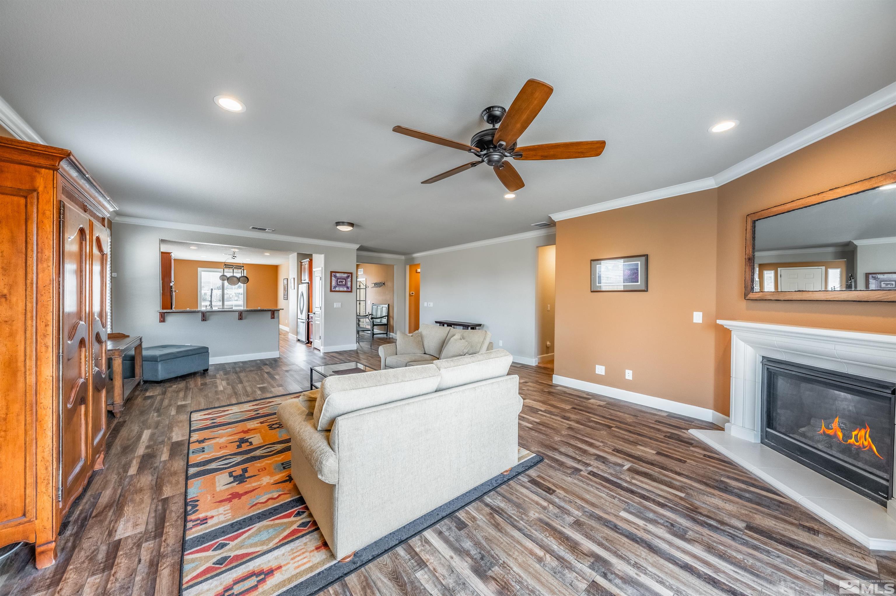 990 Broderick Trail Reno, NV 89523 - Photo 21 of 38 a living room with furniture and a fireplace